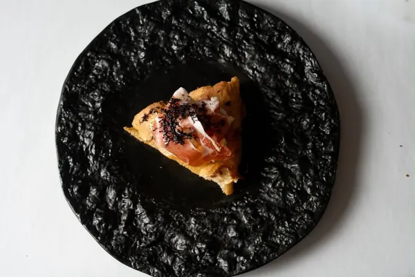 Prosciutto and shaved truffle pizza slice, The Food Hub pizza catering